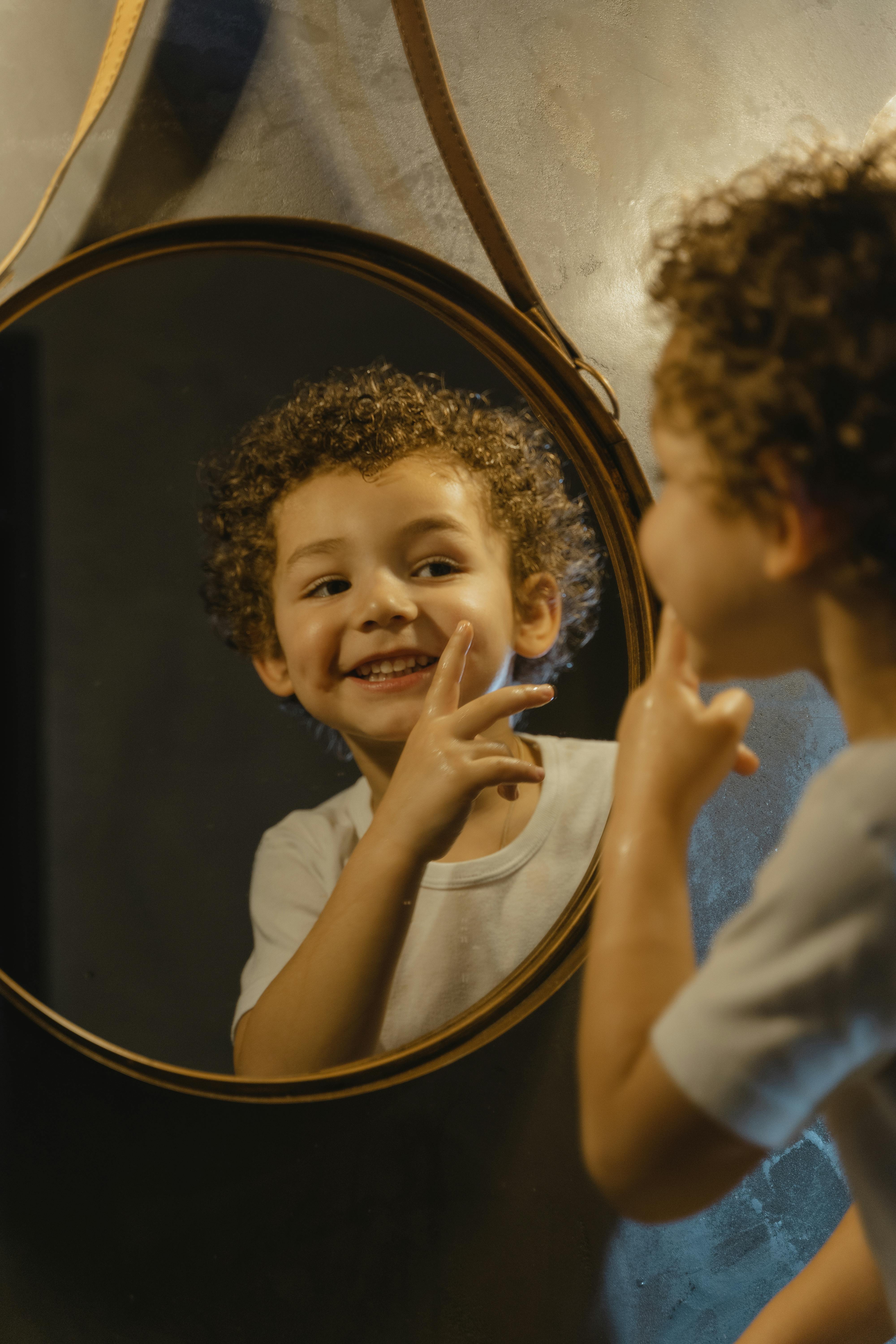 Boy Looking at a Wall Mirror · Free Stock Photo, image size:4000x6000
