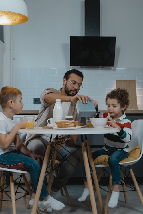 Father Having Breakfast with His Two Children