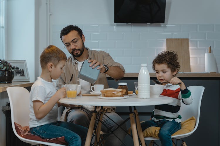 Father With Sons At Breakfast