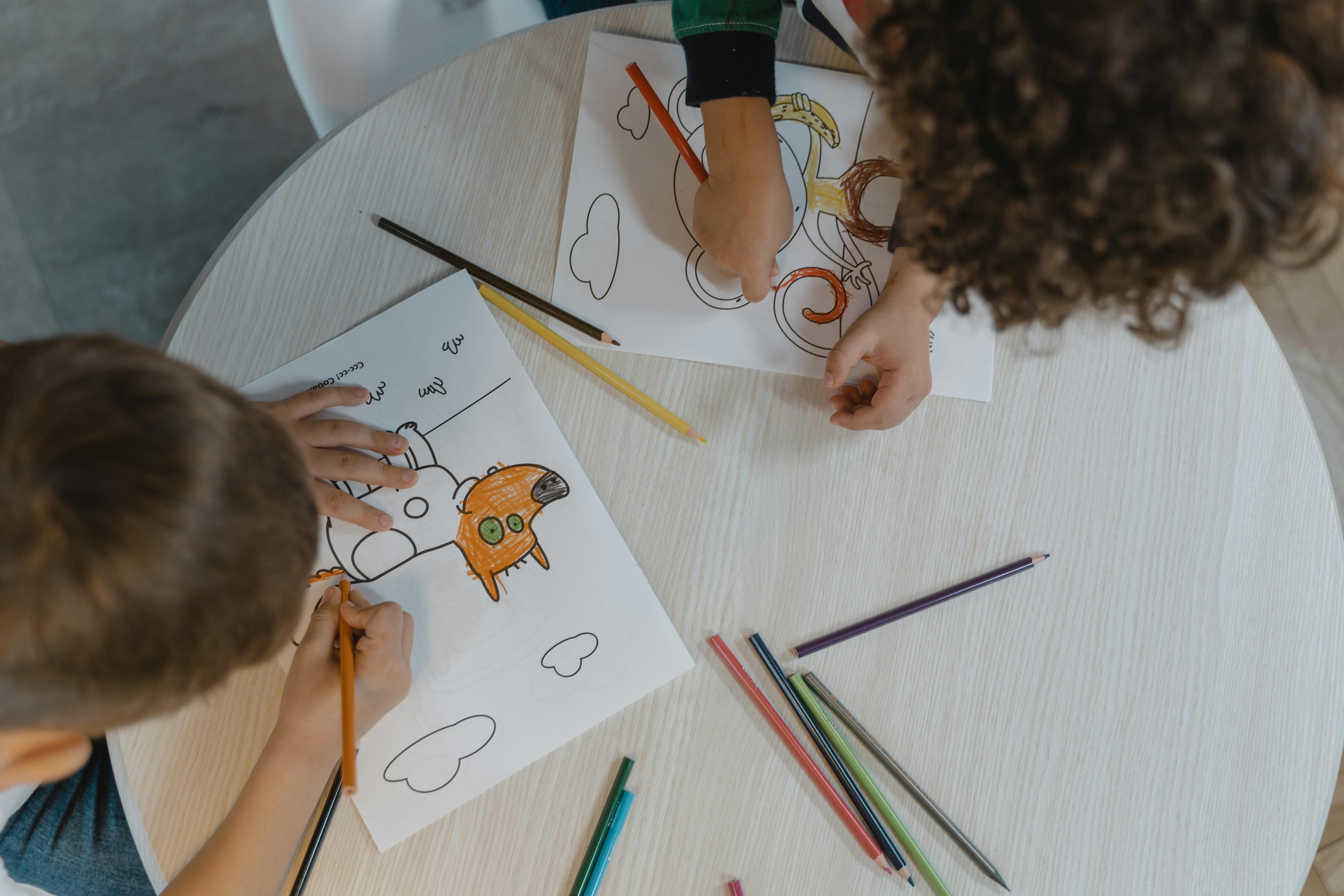 Kids Drawing On White Sheet Of Paper Background Stock Photo, Picture and  Royalty Free Image. Image 49661649.