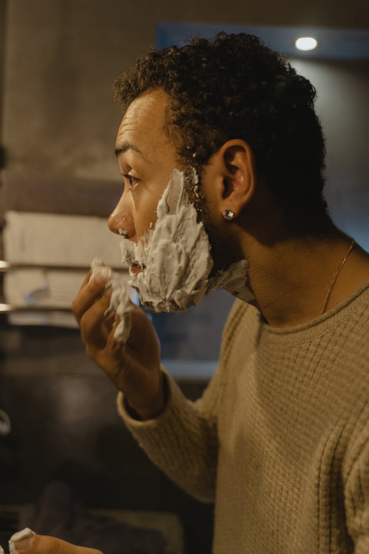 Man Putting Shaving Cream On His Face