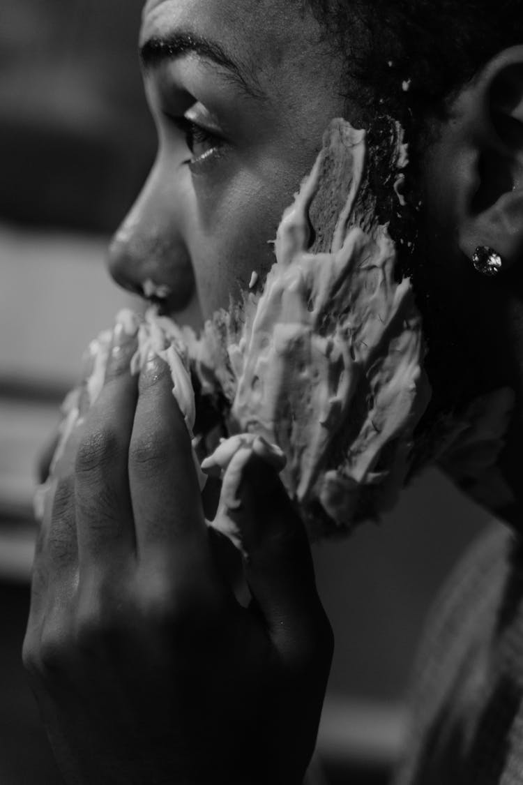 Grayscale Photo Of A Person Putting Shaving Foam On His Face