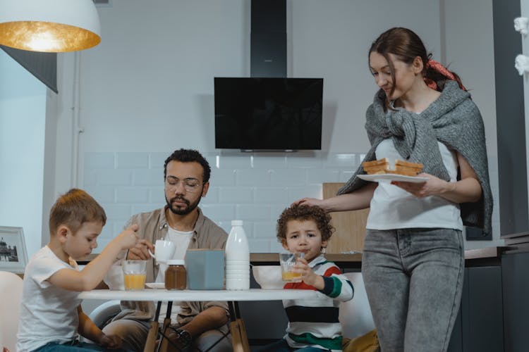 A Happy Family Eating Snacks Together