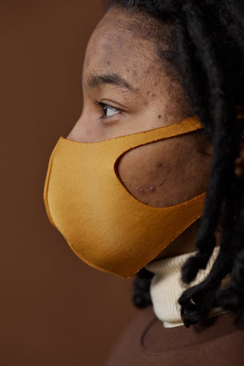 Side View of a Woman Wearing Face Mask · Free Stock Photo