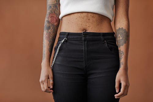 Free A Tattooed Person with Acne on Her Belly Stock Photo