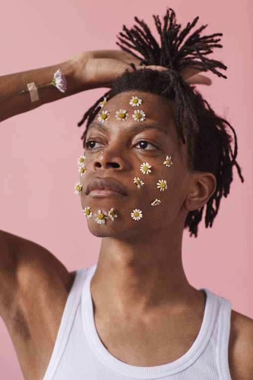 Man in White Tank Top with Flowers in Face