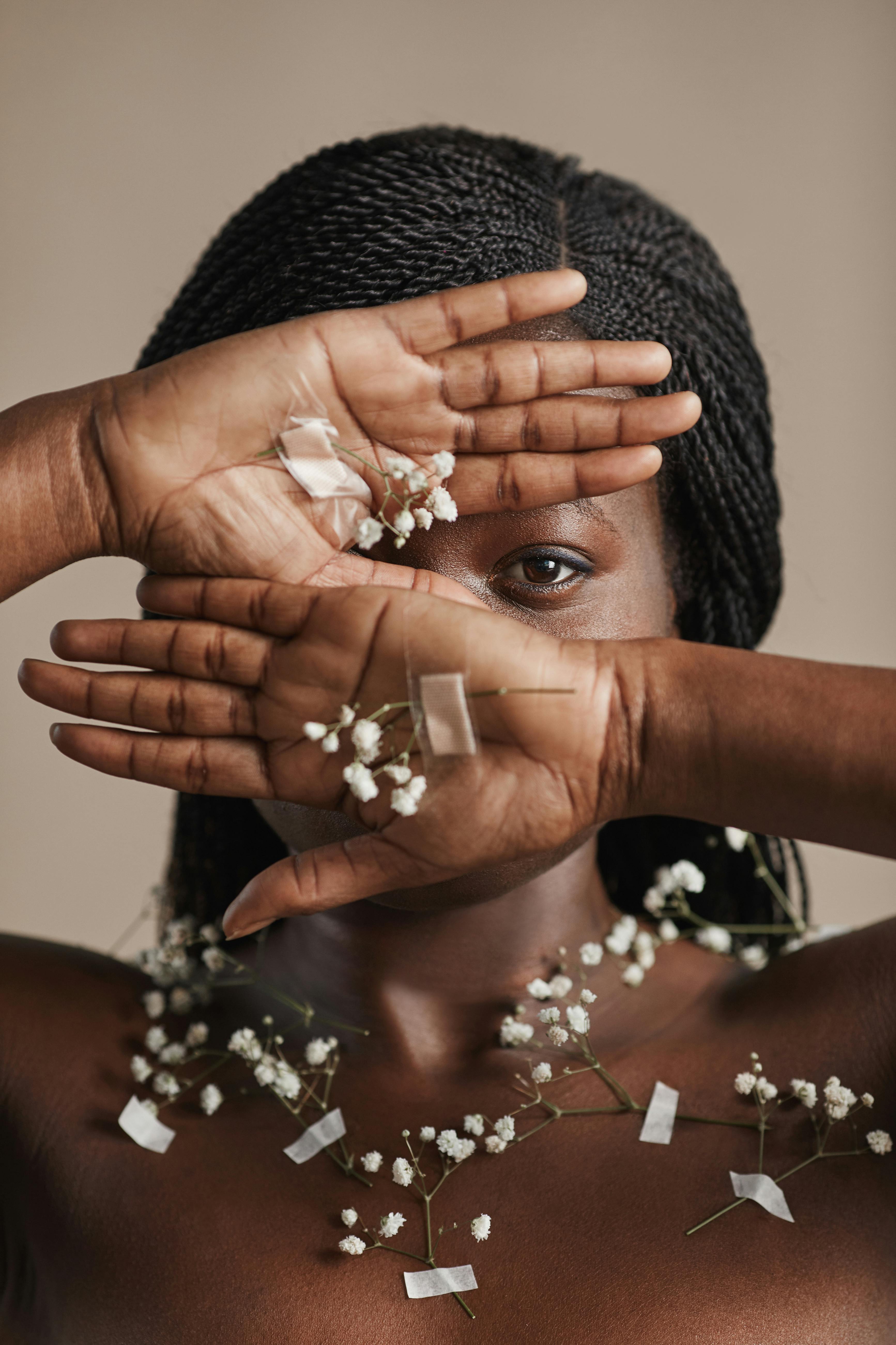 a woman covering her face