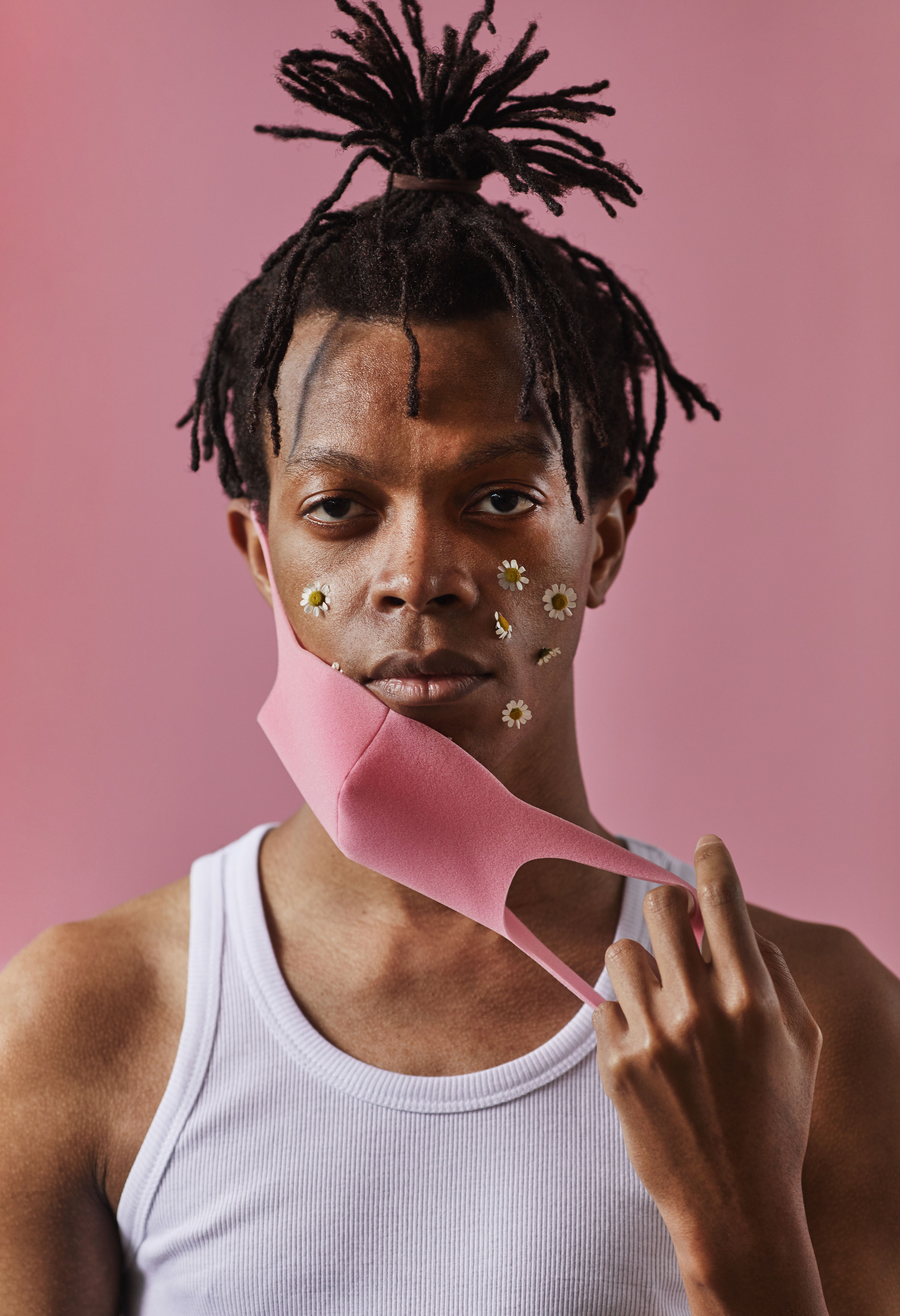 A Man in White Tank Top and Pink Face Mask · Free Stock Photo