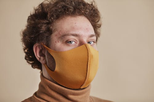 A Man Wearing Brown Face Mask