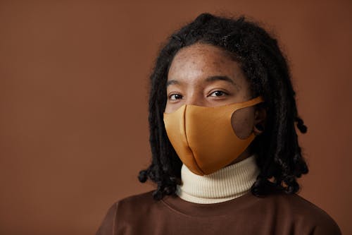 Portrait of a Woman Wearing Brown Face Mask