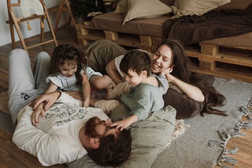 Free A loving family enjoying a relaxing moment together indoors. Stock Photo