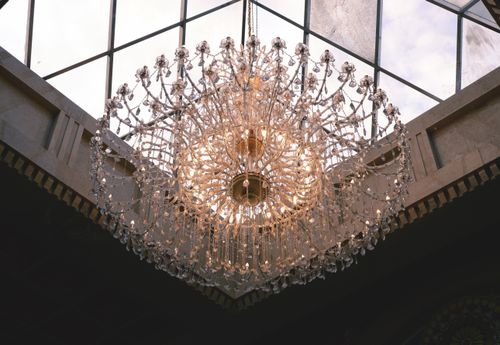 Free Glamorous crystal chandelier hanging inside a traditional building in Cebu City, captivating and intricate design. Stock Photo