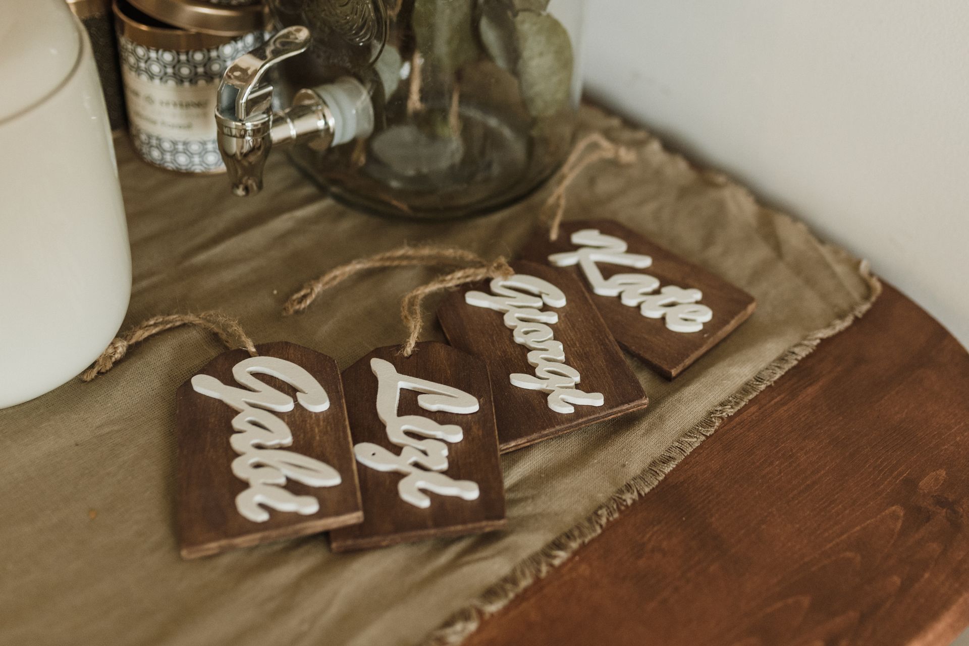 Wooden Name Tags on the Brown Fabric