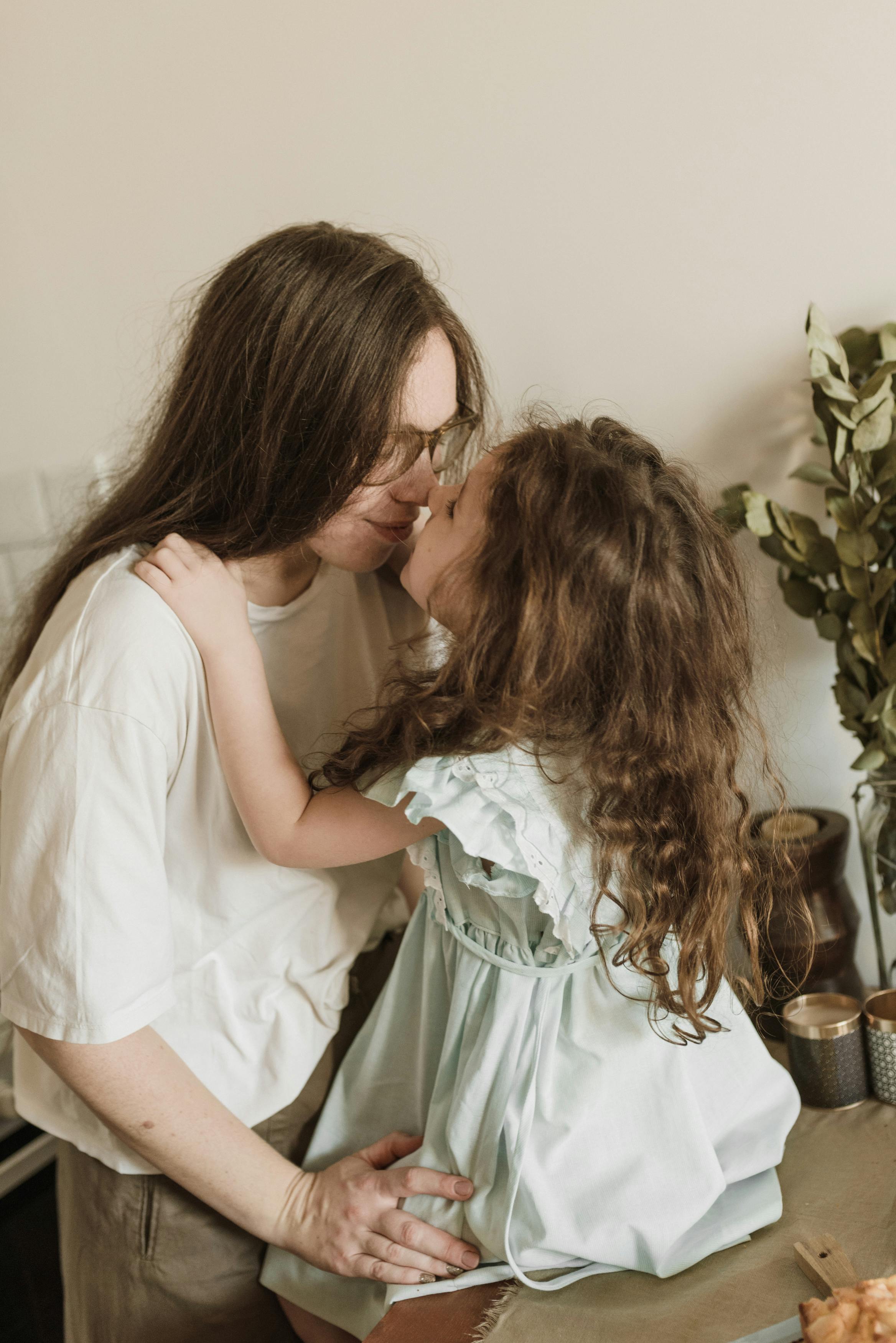 daughter playing with her mother