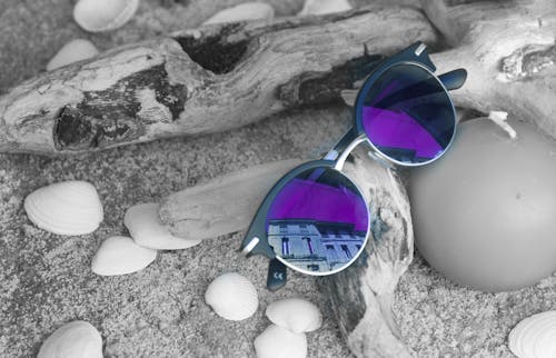 Free Neo Chrome Sunglasses With Silver and Black Frame on Brown Firewood Stock Photo