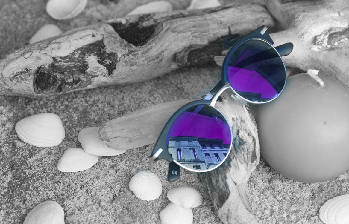 Neo Chrome Sunglasses With Silver and Black Frame on Brown Firewood
