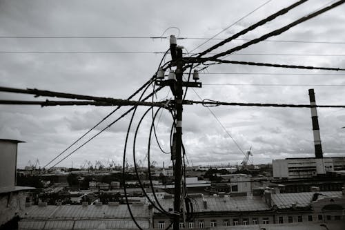 Grayscale Photo of a Power Line