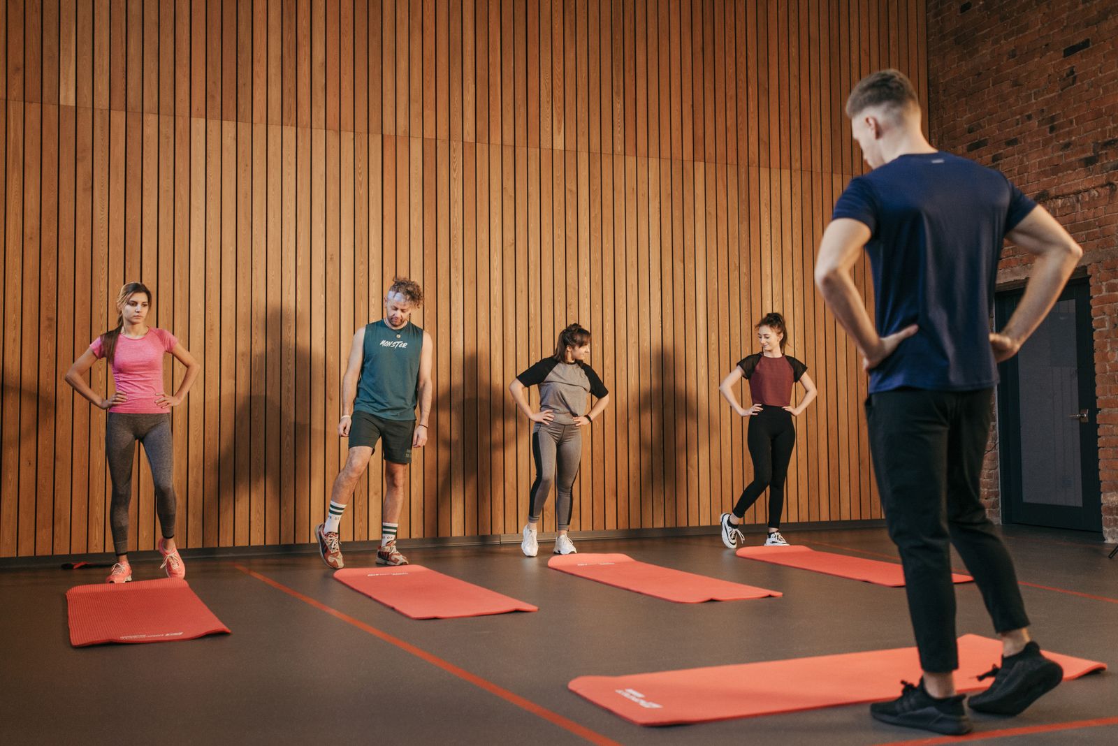 Group step workout with participants stepping on platforms