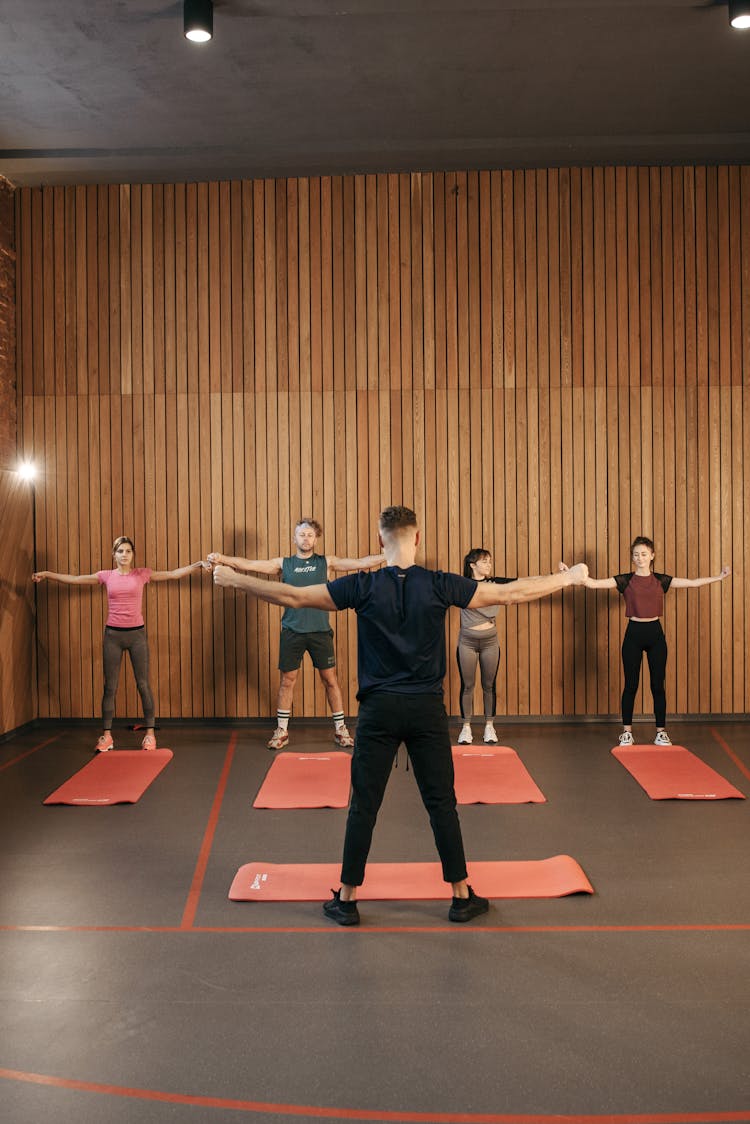 People Exercising In The Room