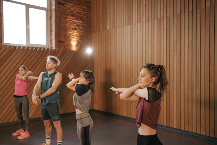 People Exercising In The Room