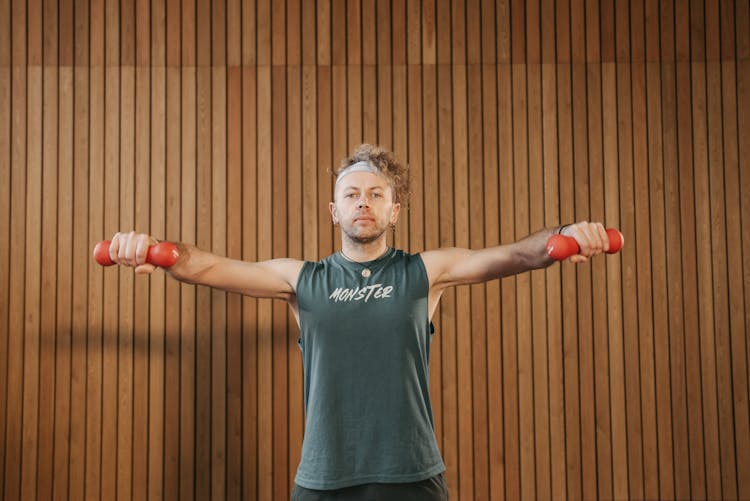 Man Lifting Two Dumbbells