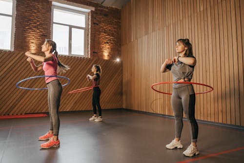 Women Exercising with Hula Hoops 