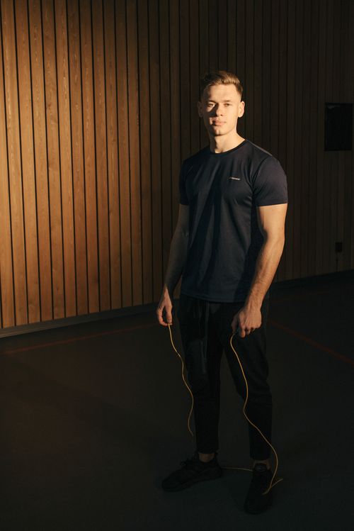 Free Fit young adult man with jump rope in gym, ready for workout. Stock Photo