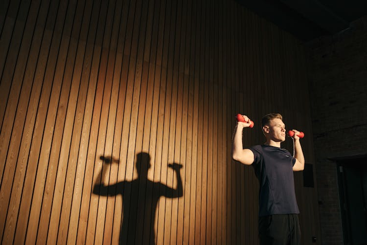 Man Lifting Two Dumbbells