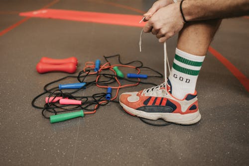 Close-Up Shot of a Person Lacing His Sneaker