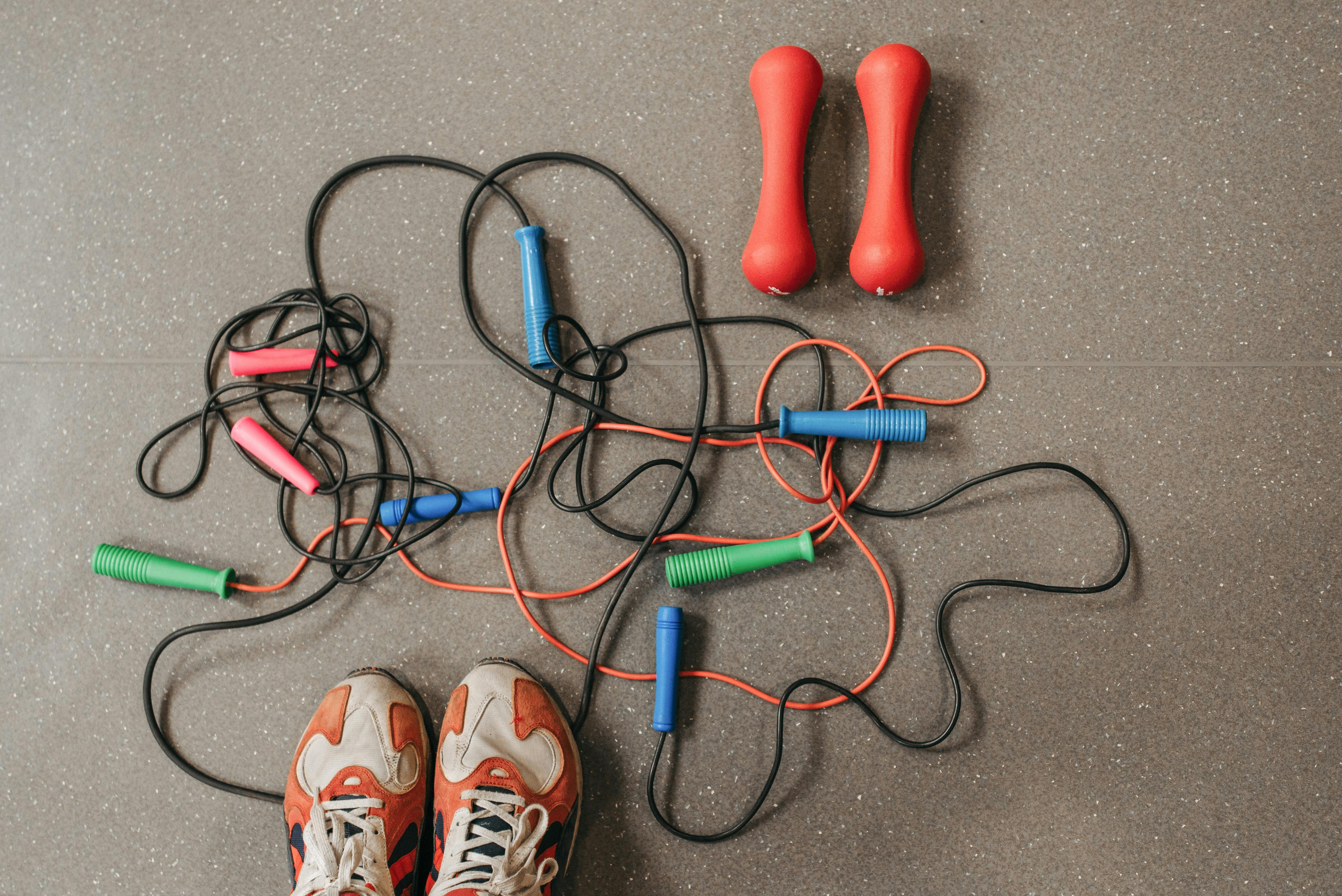jump ropes and dumbbells on the floor