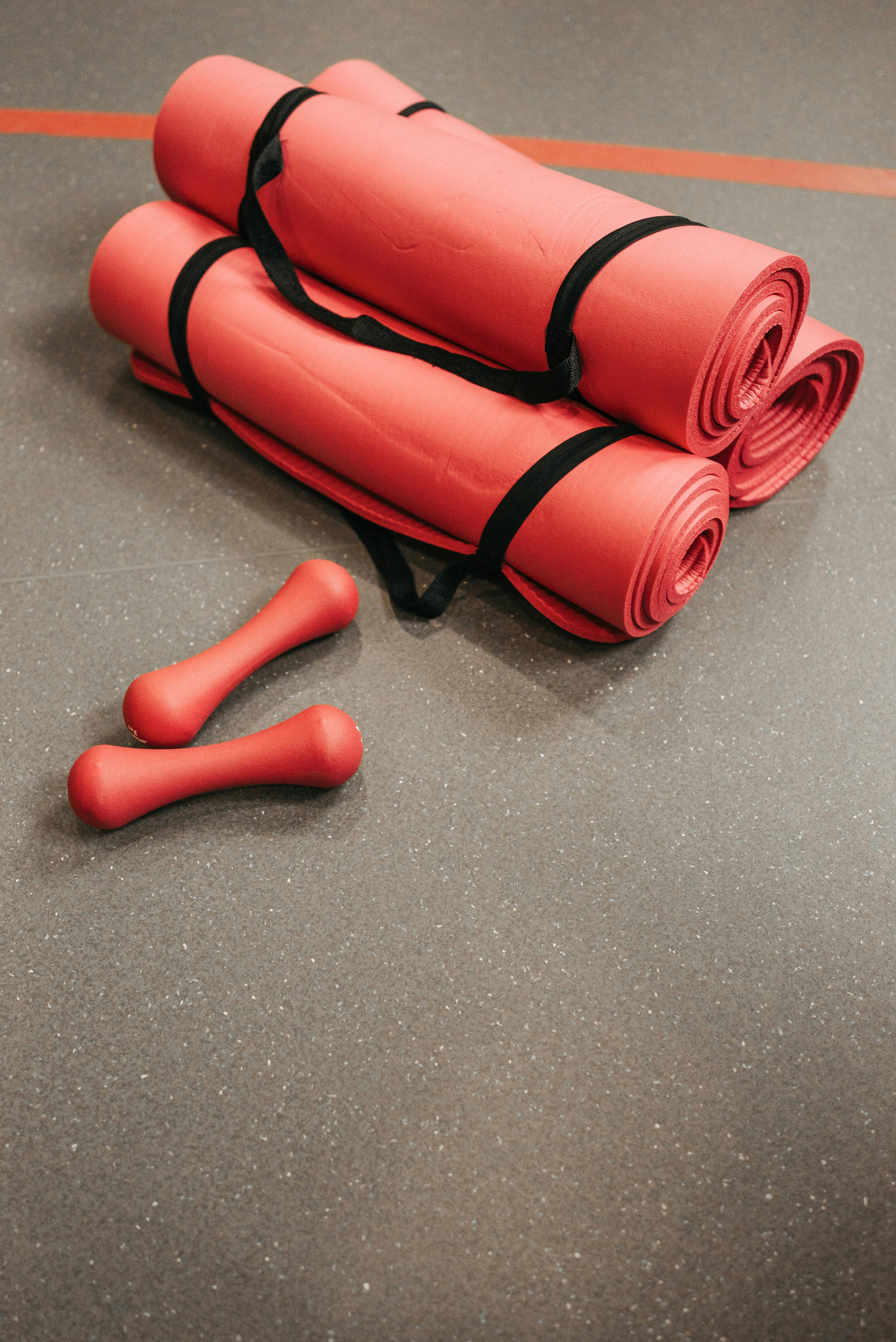 Yoga mat and dumbbells - Stock Image - F027/0691 - Science Photo Library
