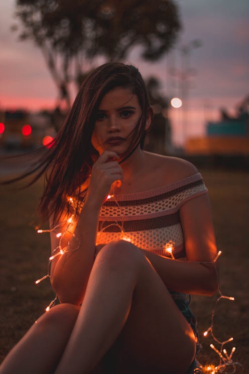 Free Photo of a Woman Holding String Lights Stock Photo