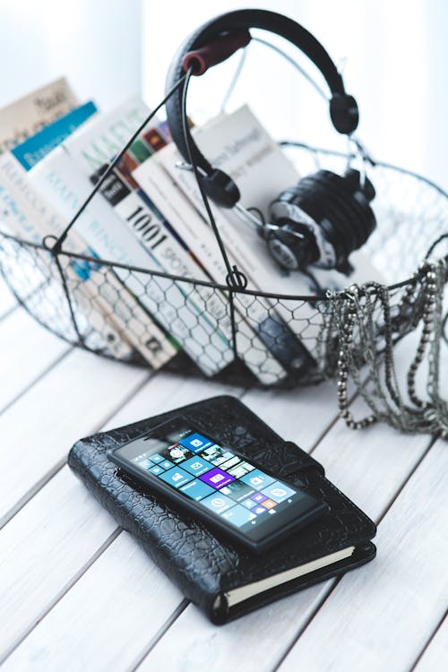 Mobile phone on a elegant black notebook