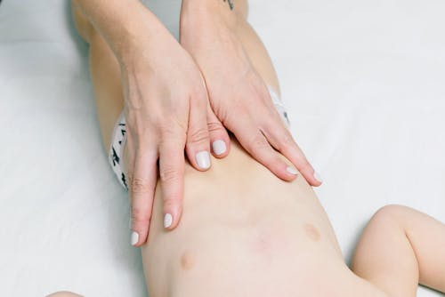 Free Person Holding the Stomach of Baby  Stock Photo