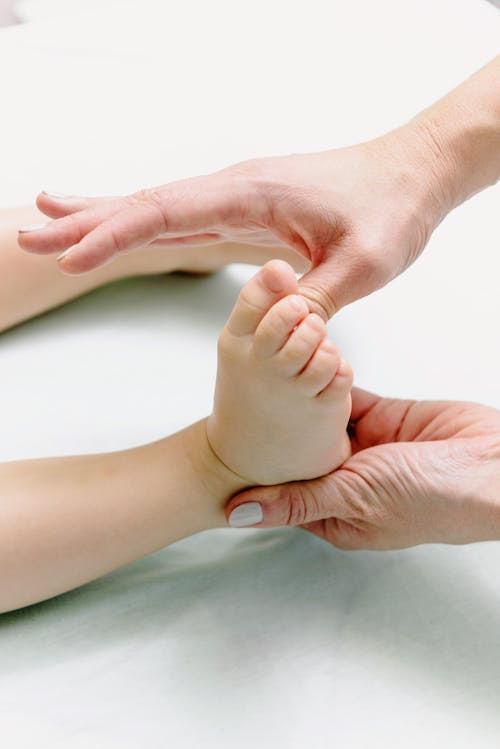 Close-Up Shot of a Baby Getting a Foot Massage