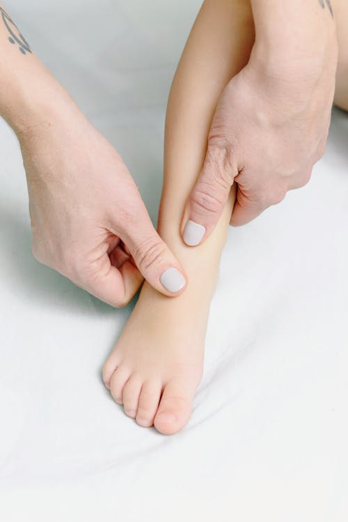 Close-Up Shot of a Baby Getting a Foot Massage