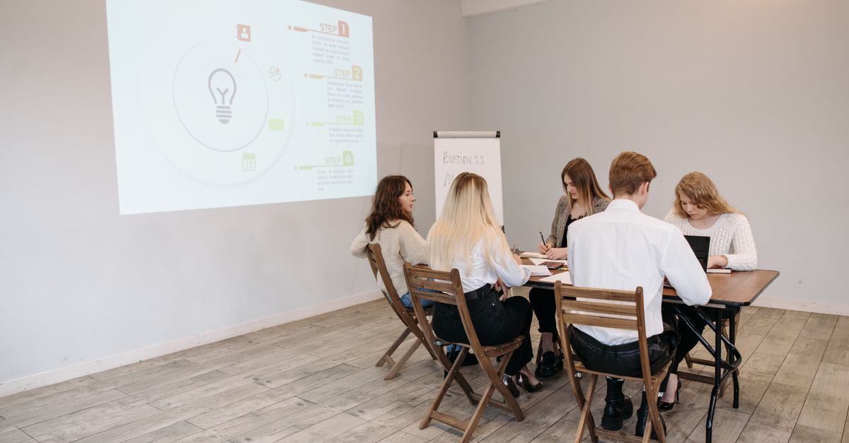 Group of young professionals collaborating in a bright office setting.