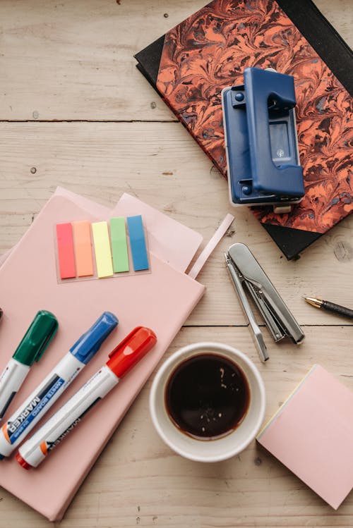 Stationery and Office Supplies on a Wooden Surface