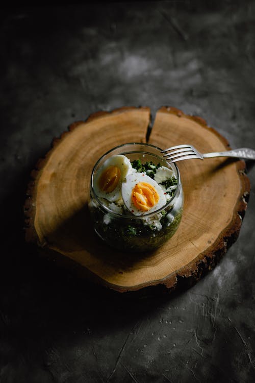 Delicious breakfast with boiled eggs and salad in jar