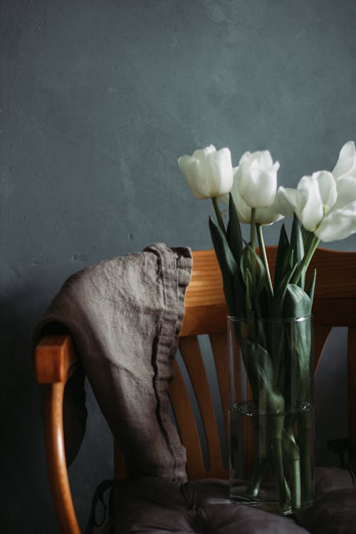 Free Vase with flowers placed on chair Stock Photo
