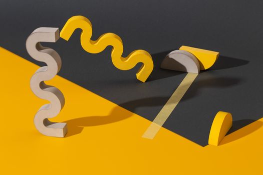 Modern composition of yellow and gray geometric shapes on contrasting backdrop.