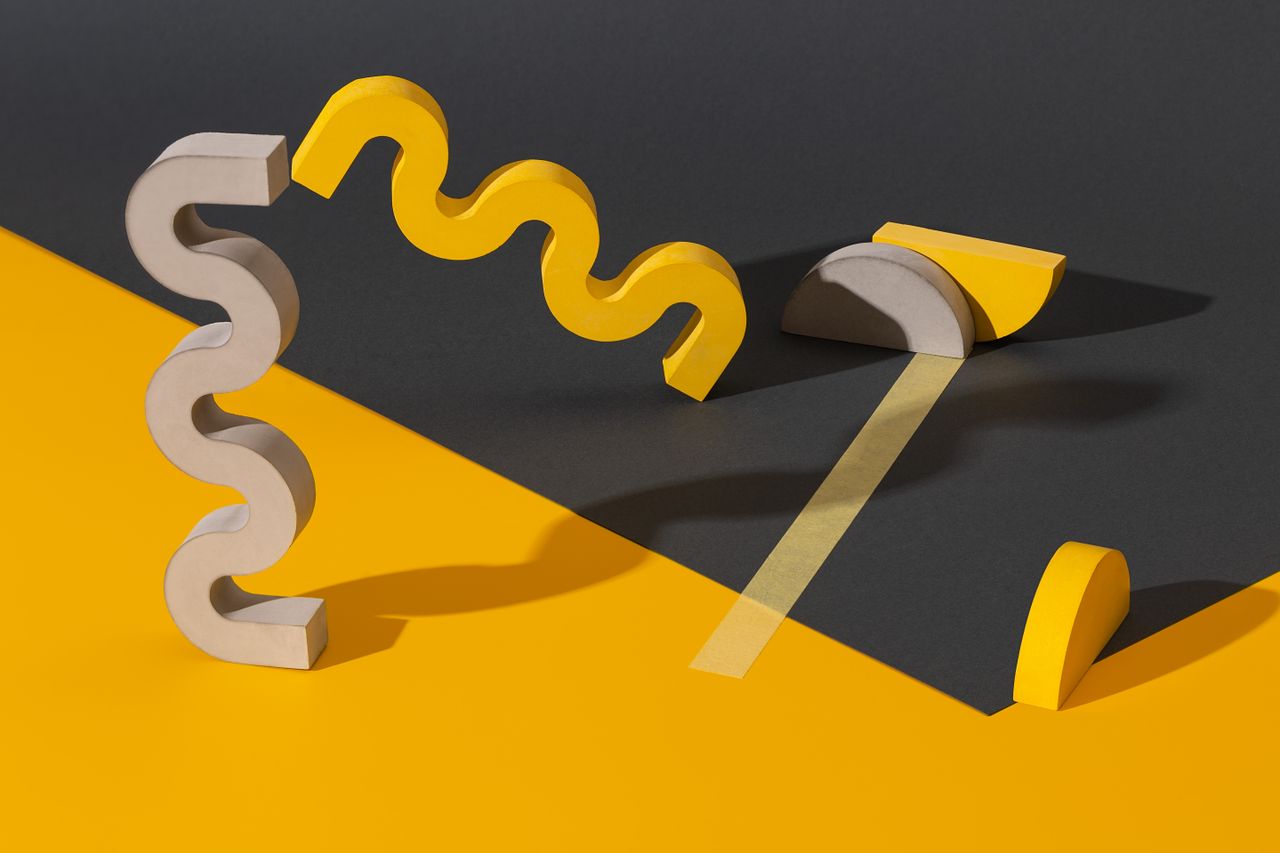 modern composition of yellow and gray geometric shapes on contrasting