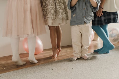 Legs of Children Dancing at a Birthday Party