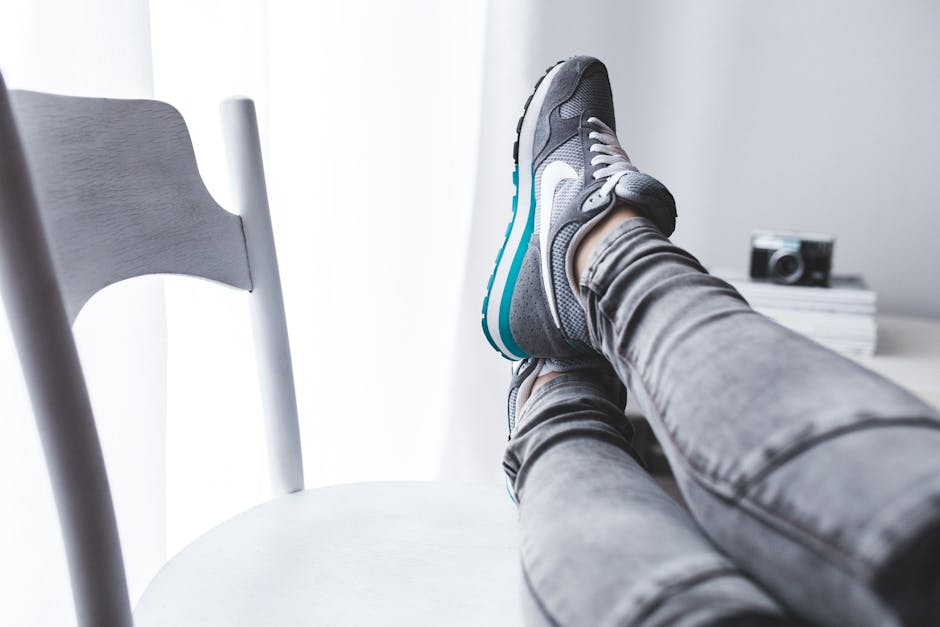 Girl resting with legs on a white chair