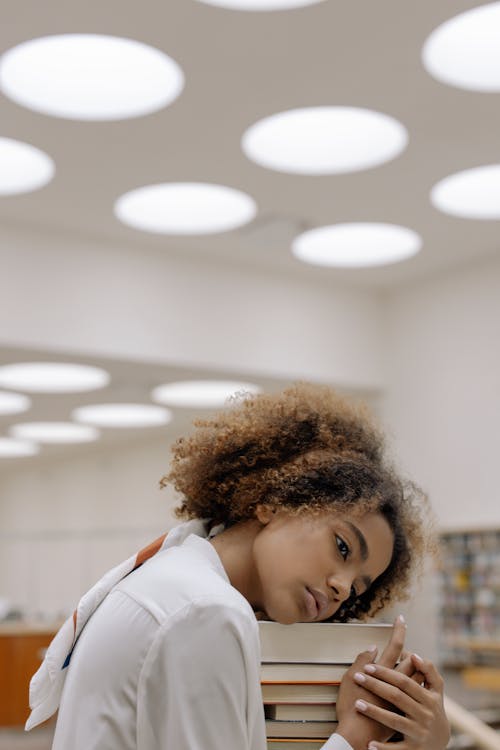 Free Photo Of Woman Hugging Stack Of Books Stock Photo
