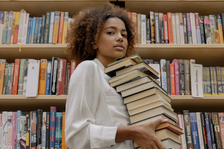 Woman Carrying Books