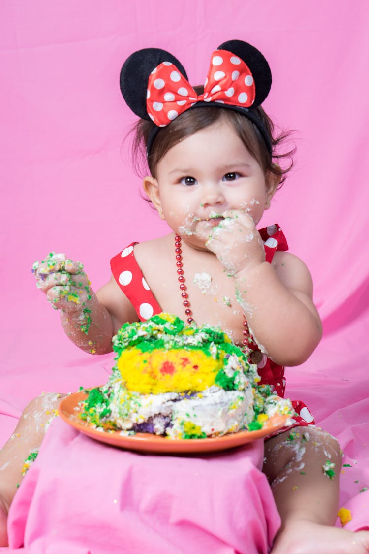 A Baby Eating Cake