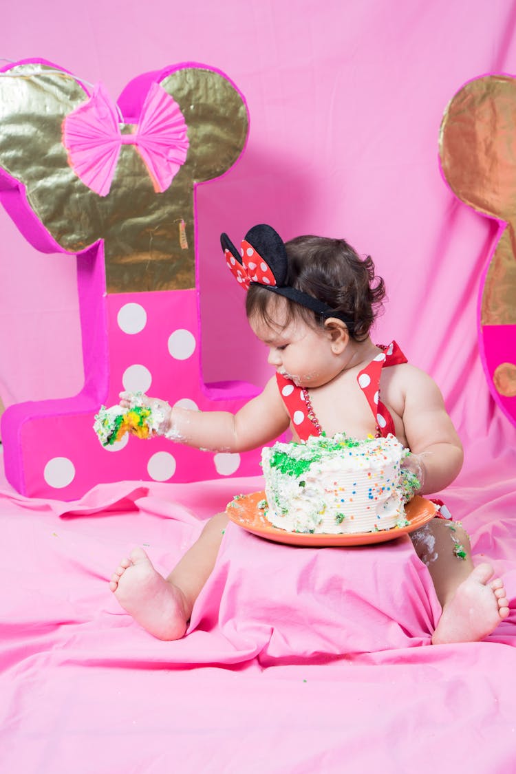 A Baby Eating Cake