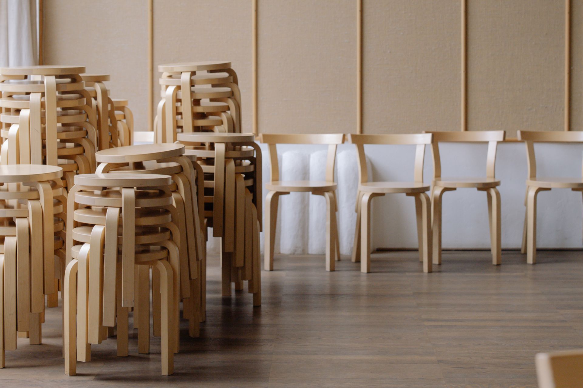 Wooden Chairs Stacked on Top of Each Other in a Modern Room