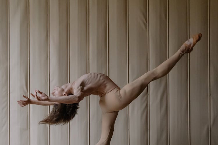 A Topless Man Dancing In The Studio